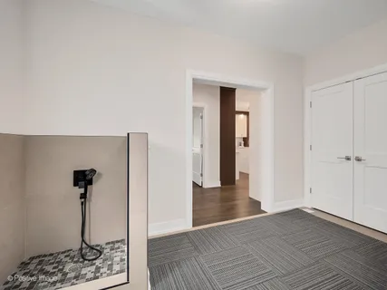 a room with a bed and a mirror