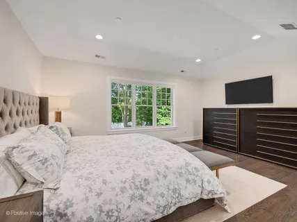 a spacious bathroom with a shower sink vanity and mirror