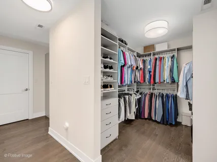 a bedroom with a bed couch and a window