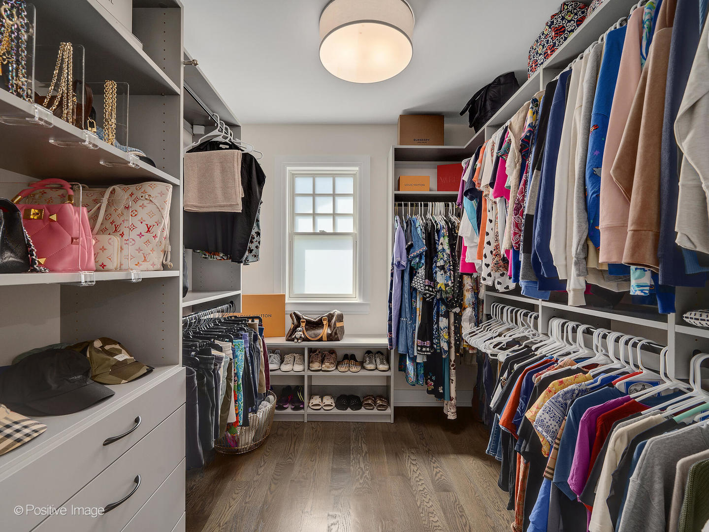 1150 Highland Avenue Lake Forest, IL 60045 - Photo 33 of 63 a view of walk in closet with clothes and shoes