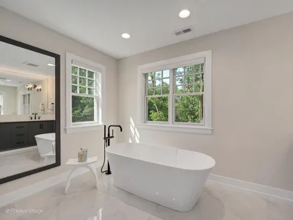 a bathroom with a sink a vanity and a mirror