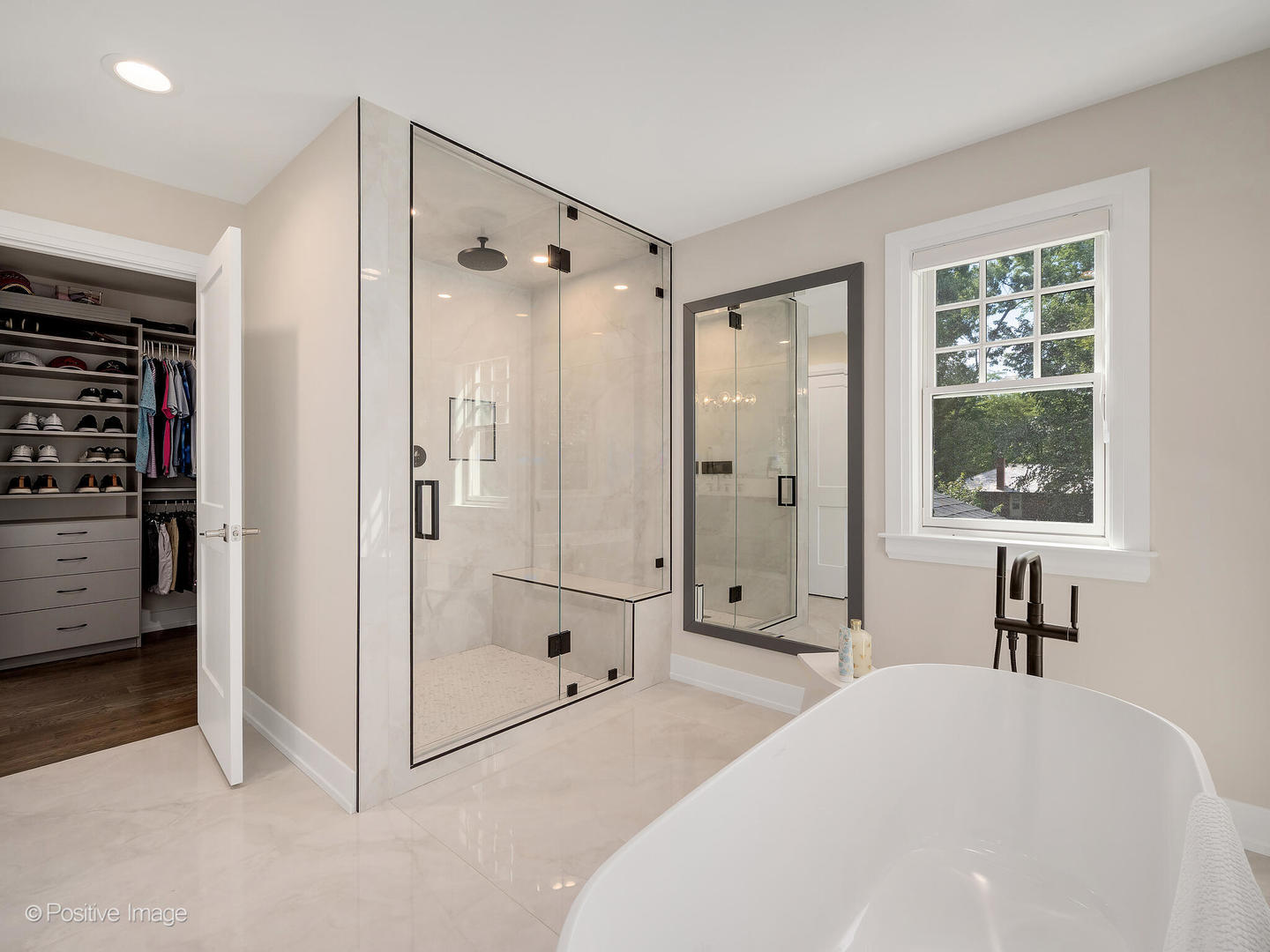 1150 Highland Avenue Lake Forest, IL 60045 - Photo 36 of 63 a spacious bedroom with a bed and a window