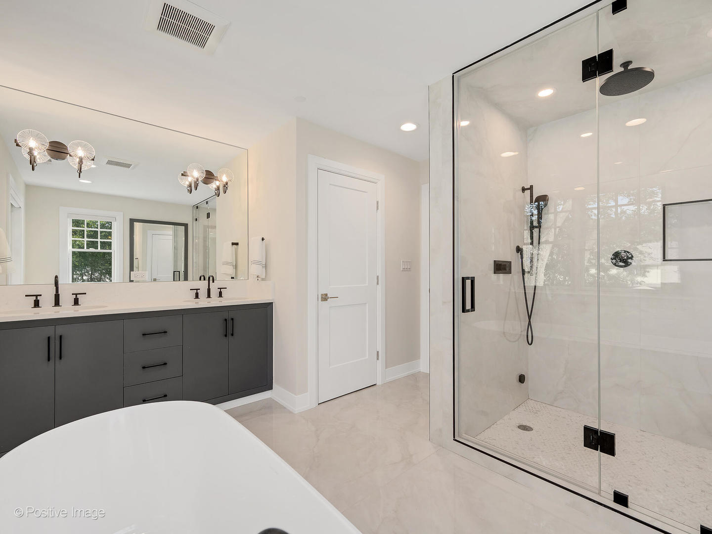 1150 Highland Avenue Lake Forest, IL 60045 - Photo 37 of 63 a spacious bathroom with a shower sink vanity and mirror