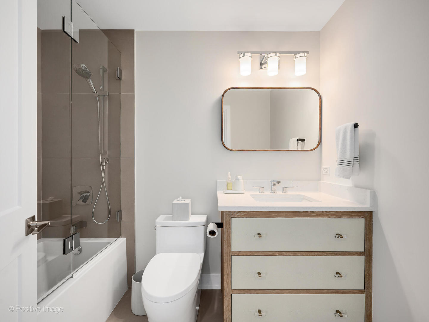 1150 Highland Avenue Lake Forest, IL 60045 - Photo 45 of 63 a bathroom with a toilet sink and mirror