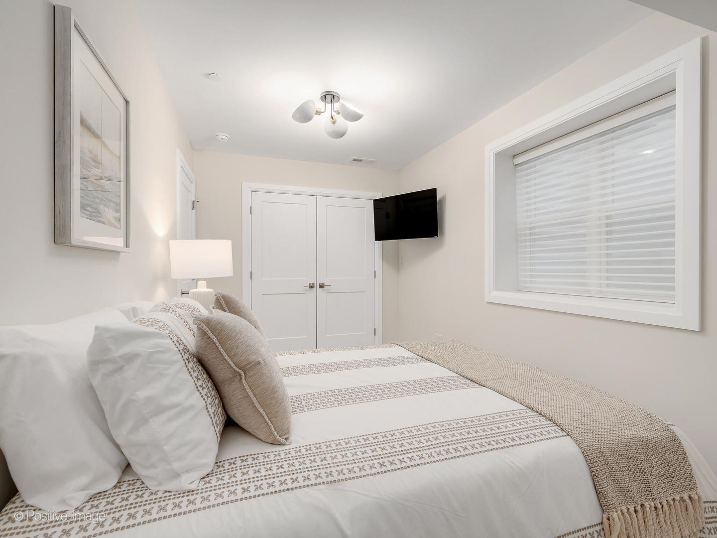 1150 Highland Avenue Lake Forest, IL 60045 - Photo 50 of 63 a bedroom with a bed and a flat screen tv