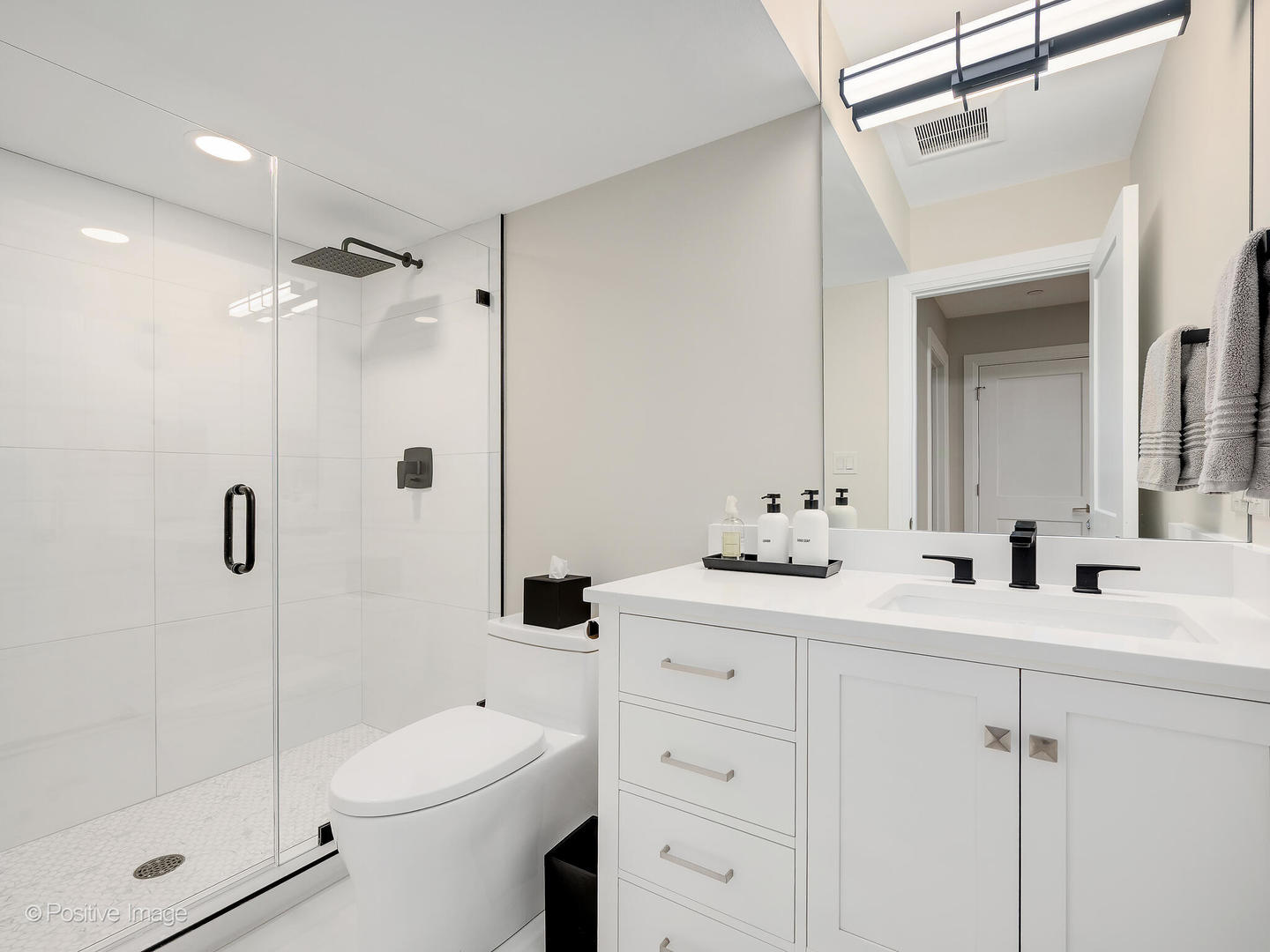 1150 Highland Avenue Lake Forest, IL 60045 - Photo 51 of 63 a bathroom with a double vanity sink mirror and shower