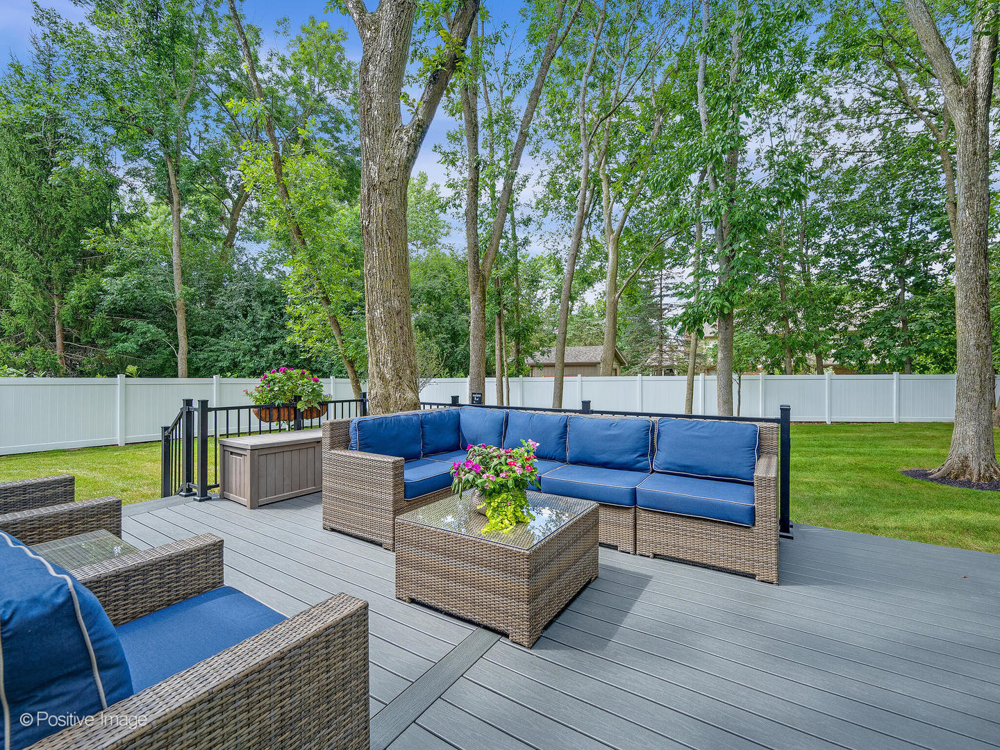 1150 Highland Avenue Lake Forest, IL 60045 - Photo 54 of 63 a view of a patio with couches and a table and chairs with wooden floor and fence