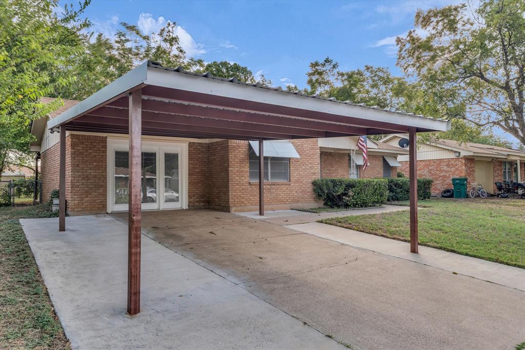 309 South Rita Street Lacy-Lakeview, TX 76705 - Photo 3 of 19 a view of a house with a porch and garden