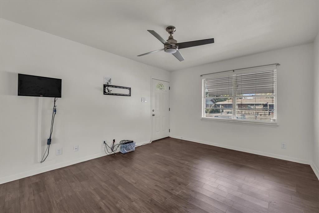 309 South Rita Street Lacy-Lakeview, TX 76705 - Photo 4 of 19 Living room with dark flooring and natural light