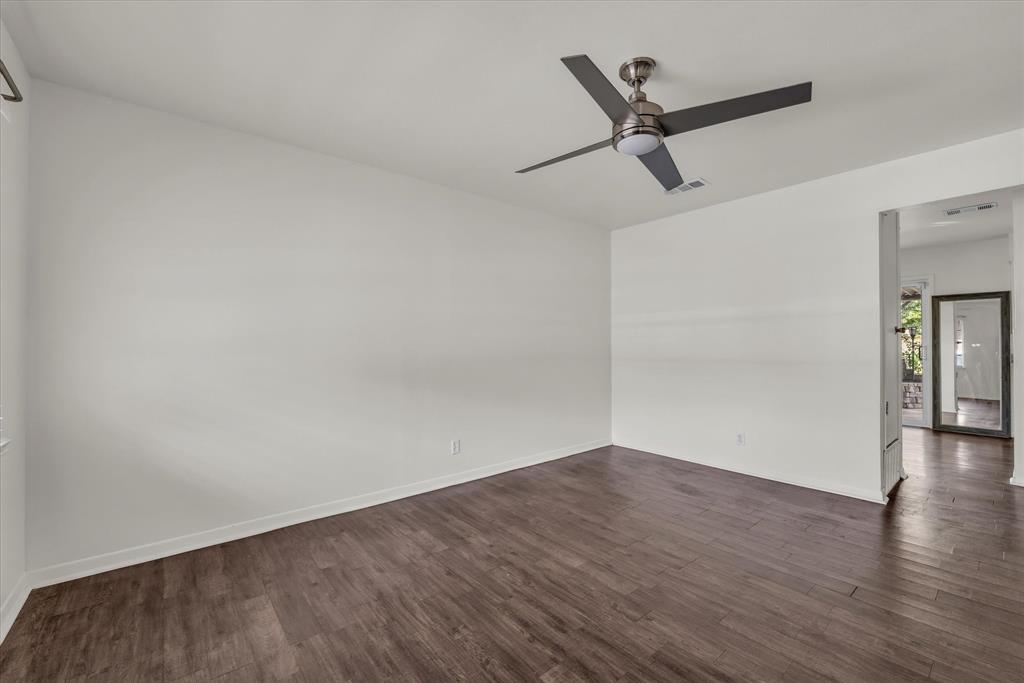 309 South Rita Street Lacy-Lakeview, TX 76705 - Photo 8 of 19 a view of a big room with wooden floor and windows
