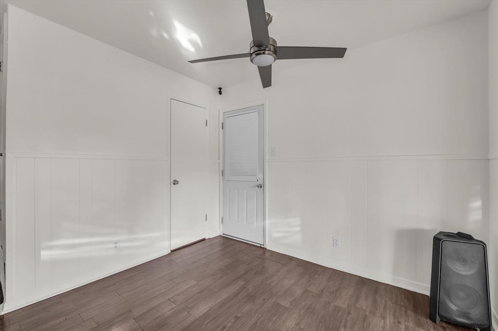 309 South Rita Street Lacy-Lakeview, TX 76705 - Photo 9 of 19 a view of room with hardwood floor and a ceiling fan