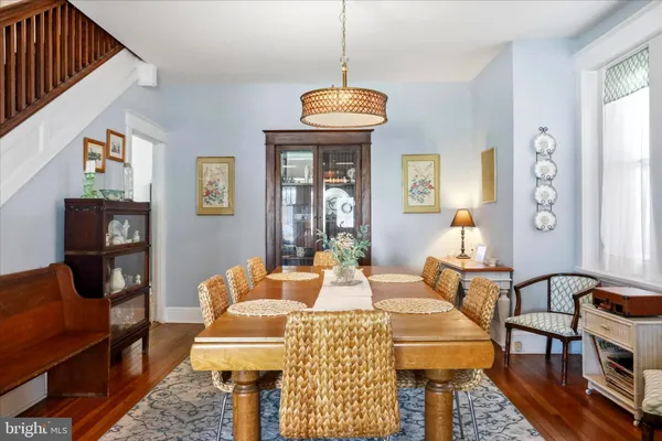 a living room with furniture a rug and a window