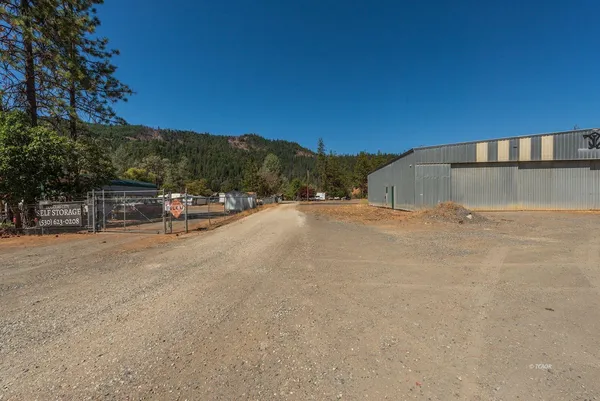 a view of a road with a building in the background