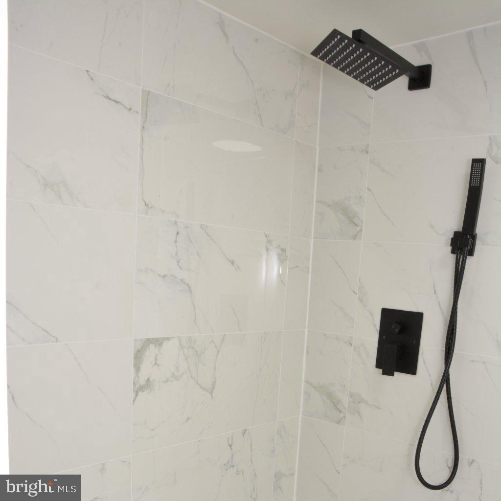 1006 Circle Drive Keymar, MD 21757 - Photo 32 of 45 Sleek modern shower with elegant tiles.