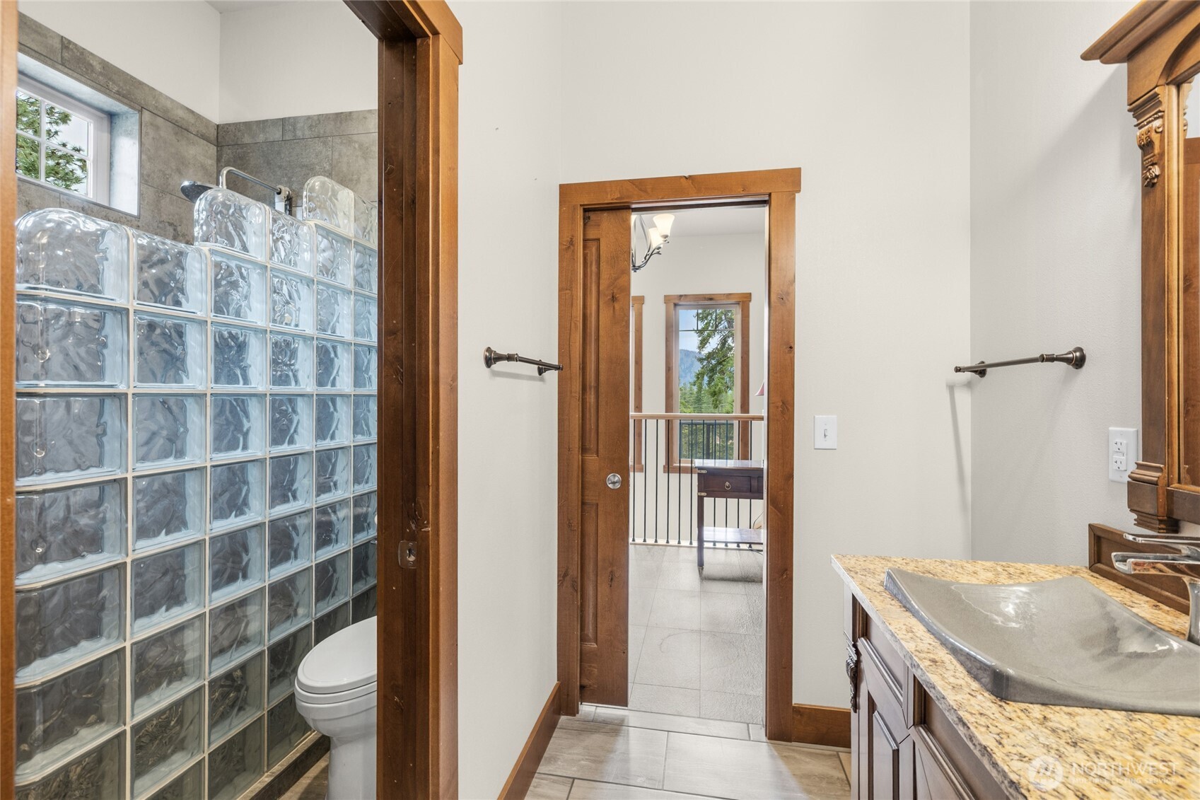 421 Meadow Ridge Drive Cle Elum, WA 98922 - Photo 20 of 39 a bathroom with a granite countertop shower a sink and a mirror
