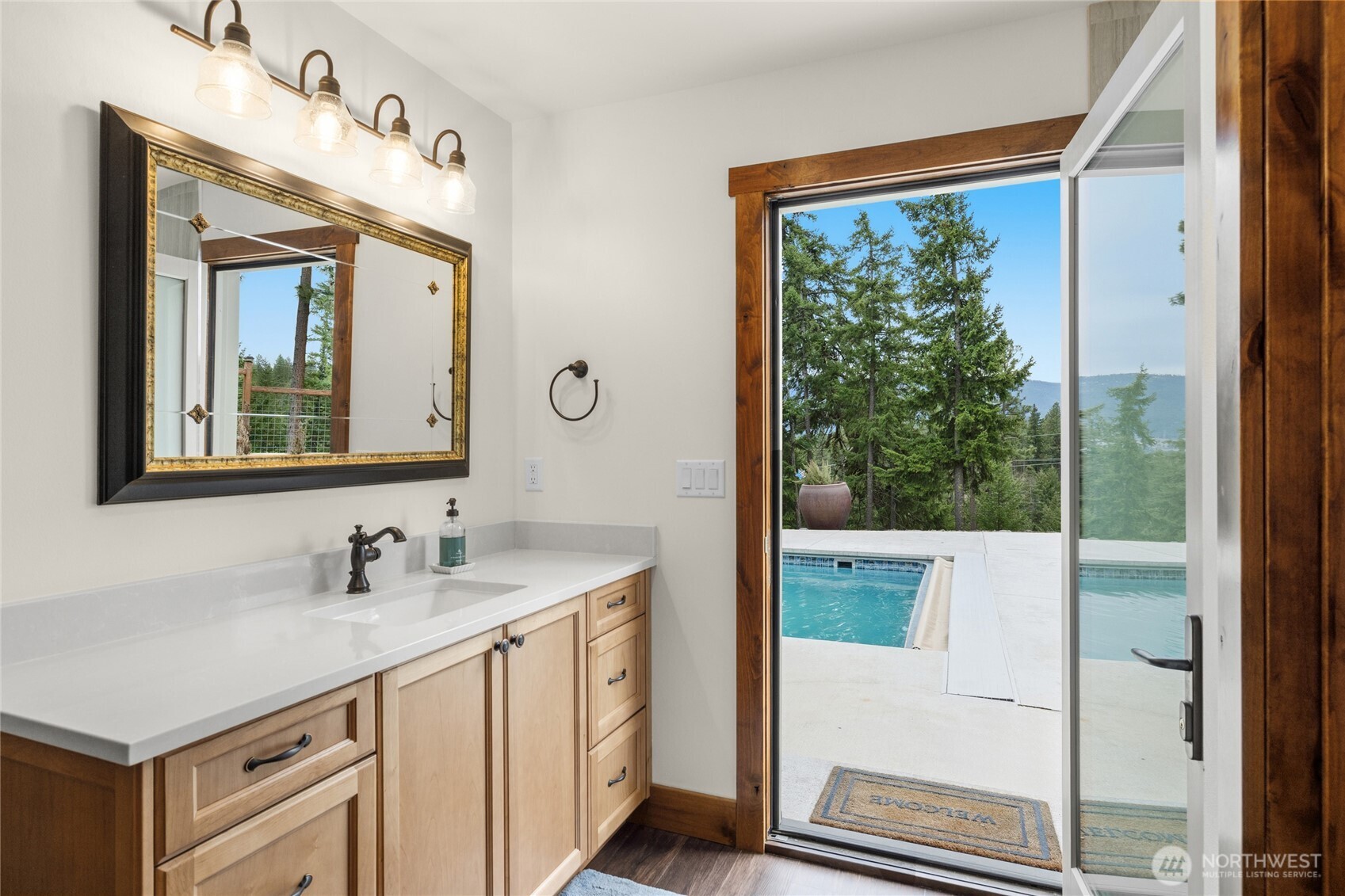 421 Meadow Ridge Drive Cle Elum, WA 98922 - Photo 22 of 39 a bathroom with a sink mirror and a window