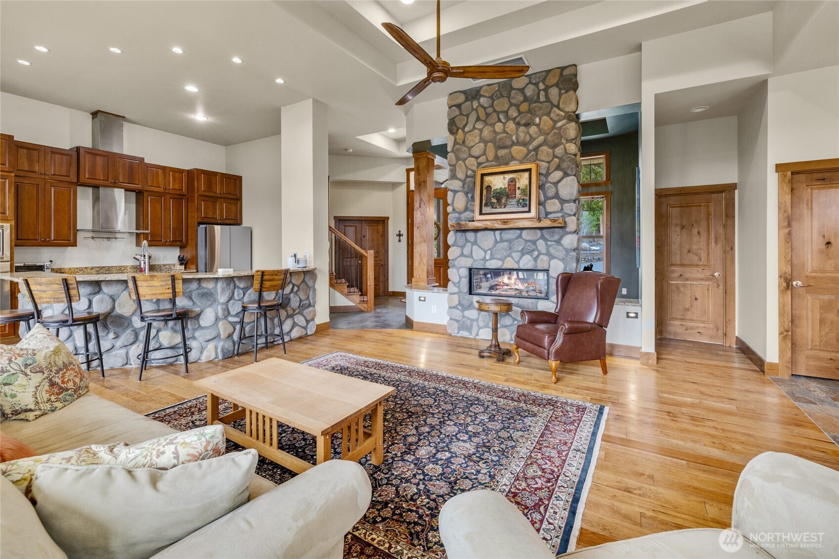 421 Meadow Ridge Drive Cle Elum, WA 98922 - Photo 9 of 39 a living room with fireplace furniture and a table