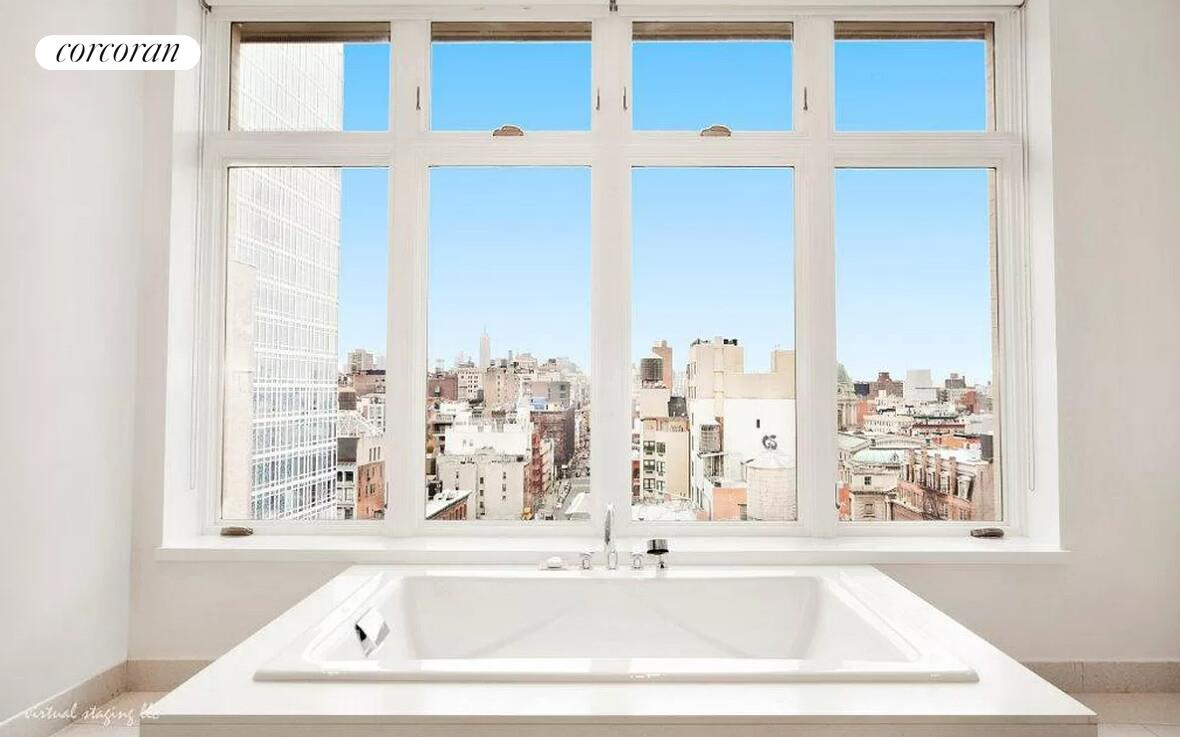 129 Lafayette Street, Unit PHA Manhattan, NY 10013 - Photo 6 of 8 a white bath tub sitting next to a window