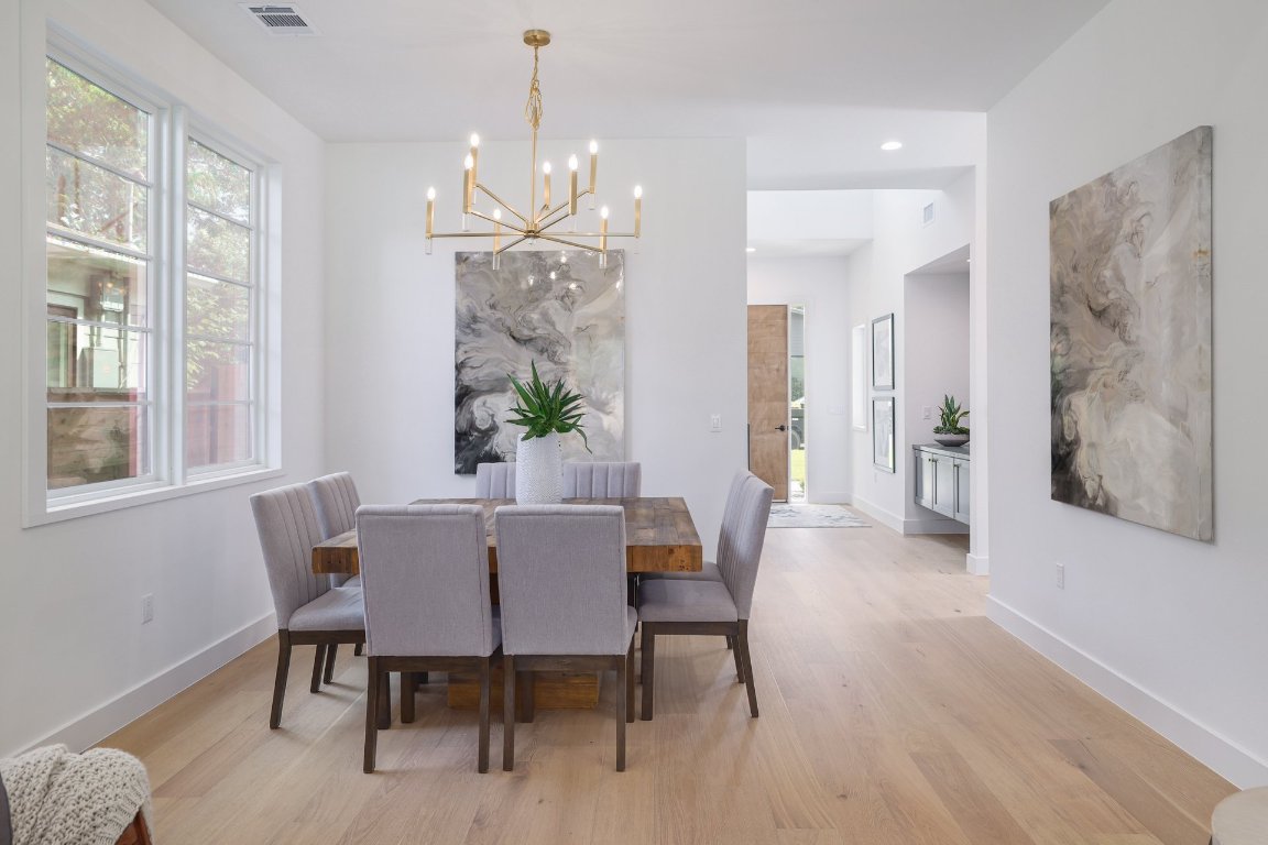 1703 Piedmont Avenue Austin, TX 78757 - Photo 15 of 37 a view of a dining room with furniture window and wooden floor