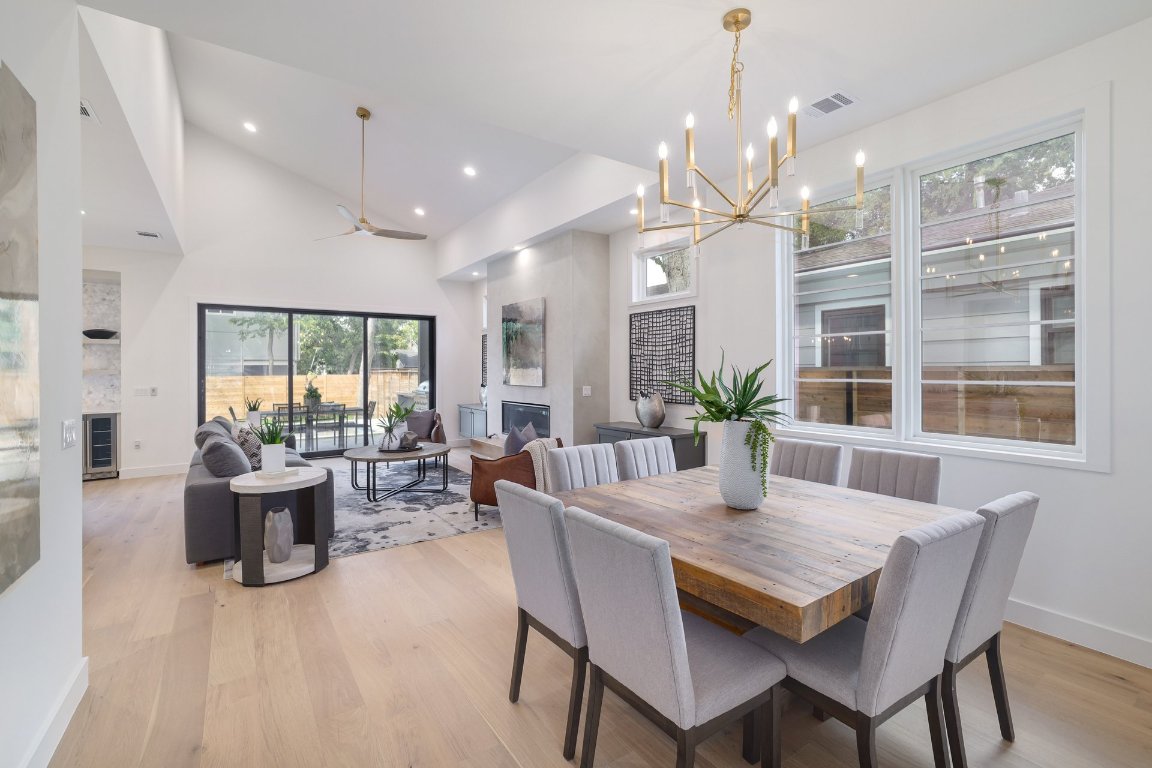 1703 Piedmont Avenue Austin, TX 78757 - Photo 16 of 37 a view of a dining room with furniture window and wooden floor