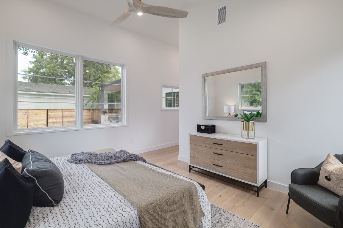1703 Piedmont Avenue Austin, TX 78757 - Photo 19 of 37 a bedroom with a bed and a dresser
