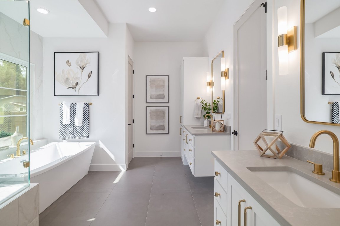 1703 Piedmont Avenue Austin, TX 78757 - Photo 21 of 37 a spacious bathroom with a tub sink and mirror