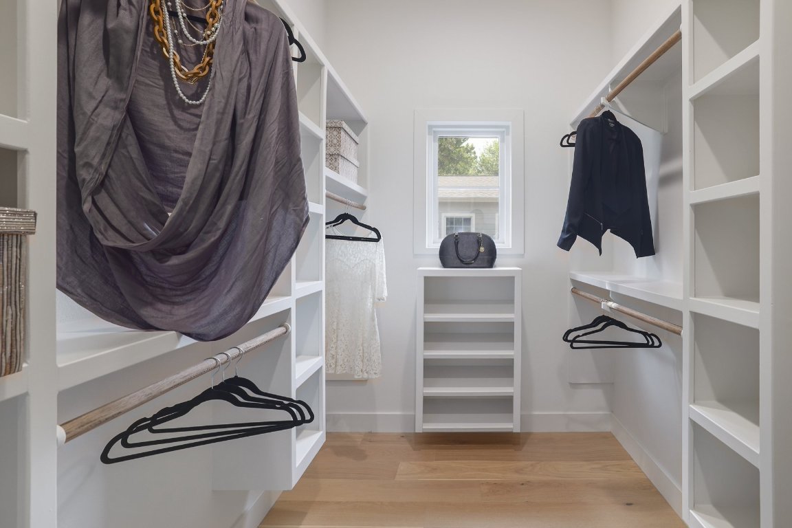1703 Piedmont Avenue Austin, TX 78757 - Photo 22 of 37 a view of walk in closet with clothes and shoes