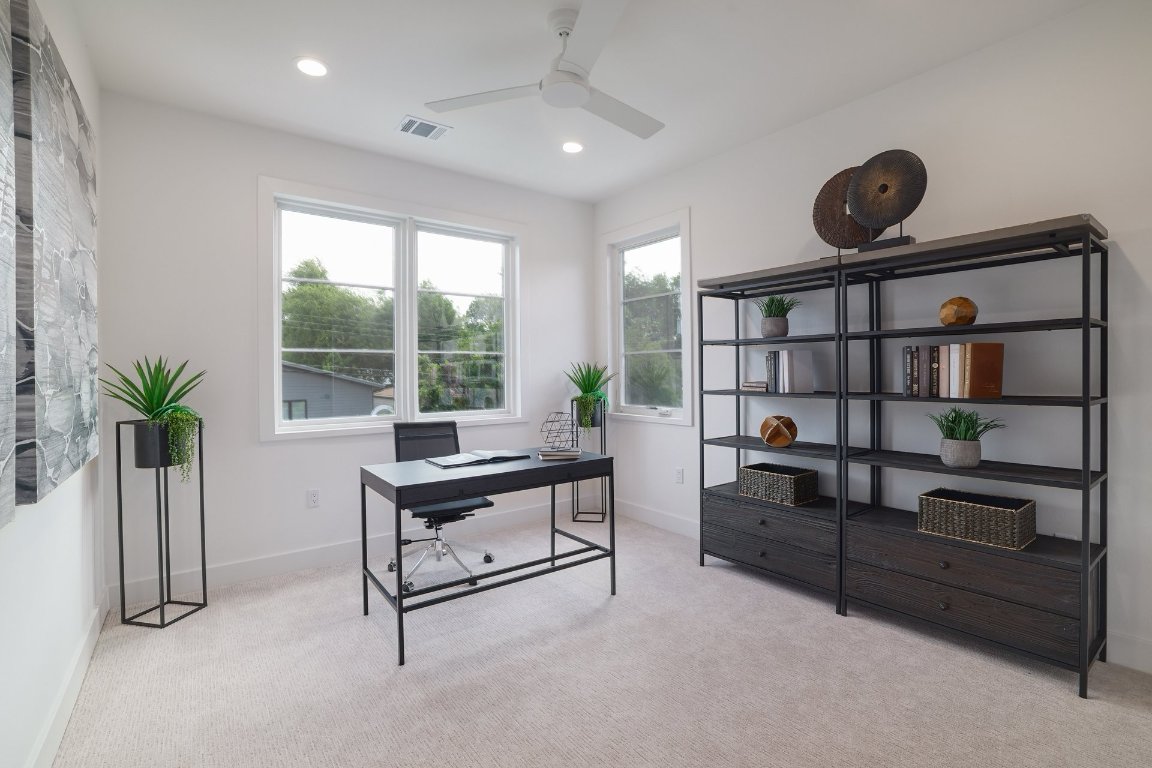 1703 Piedmont Avenue Austin, TX 78757 - Photo 26 of 37 a living room with furniture lamp and potted plant