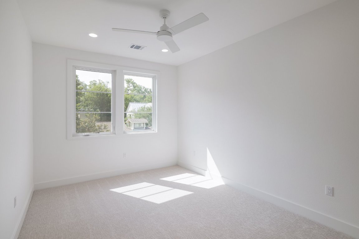 1703 Piedmont Avenue Austin, TX 78757 - Photo 28 of 37 an empty room with windows