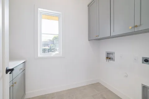 a front view of house with yard and outdoor seating