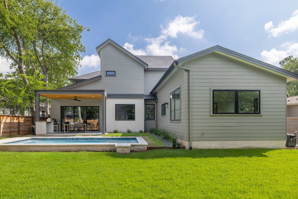 1703 Piedmont Avenue Austin, TX 78757 - Photo 35 of 37 a front view of house with yard and outdoor seating