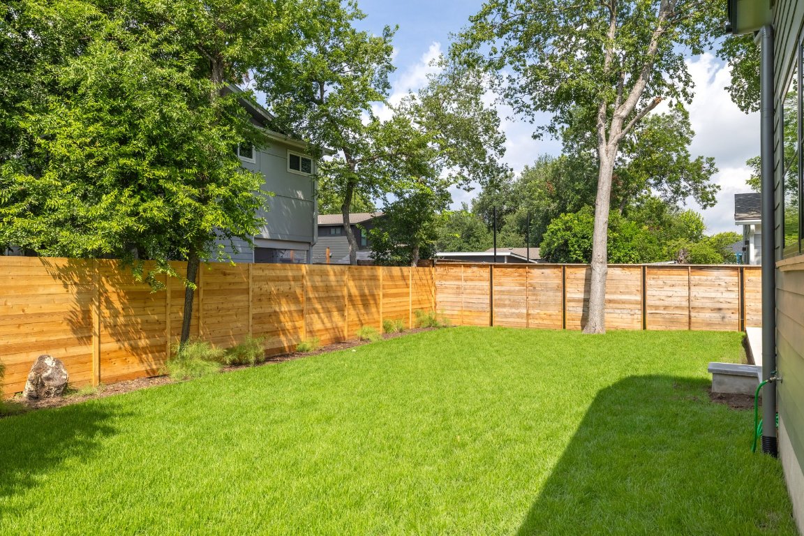 1703 Piedmont Avenue Austin, TX 78757 - Photo 36 of 37 a view of a backyard with a small house