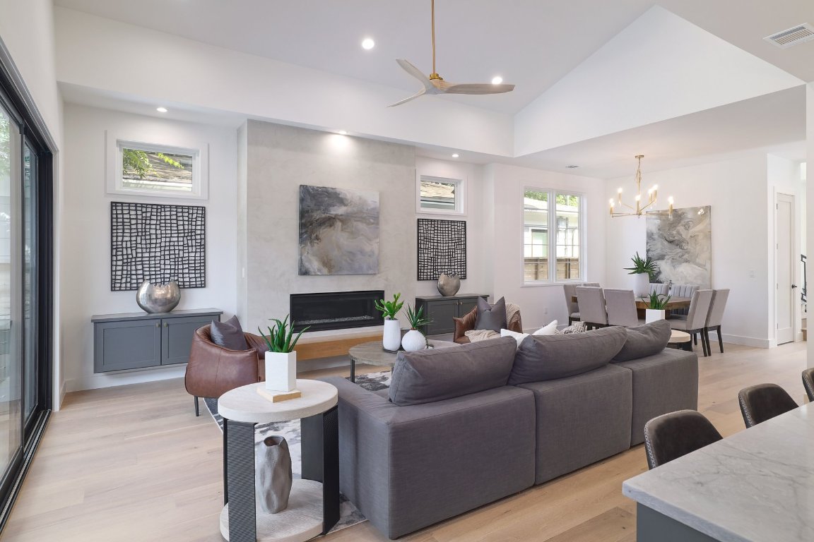 1703 Piedmont Avenue Austin, TX 78757 - Photo 7 of 37 a living room with furniture and a wooden floor