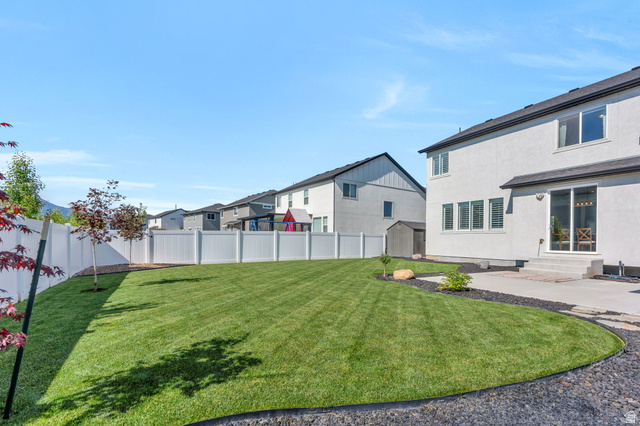 252 North Sunrise Rnch Drive Mapleton, UT 84664 - Photo 6 of 62 Expansive green lawn with a white privacy fence
