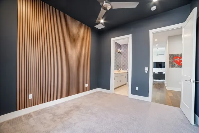 a view of a livingroom with wooden floor and entryway