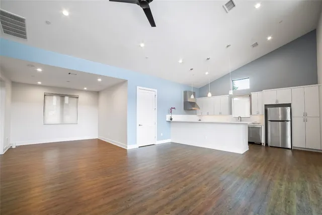 a view of kitchen with wooden floor