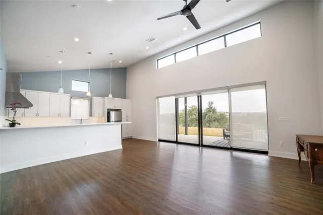 a view of kitchen with cabinets and wooden floor