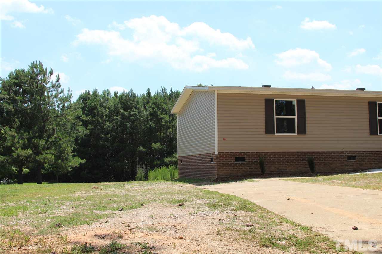 10395 Smith Road Middlesex, NC 27557 - Photo 5 of 12 Partially paved driveway and wide gravel area for parking!