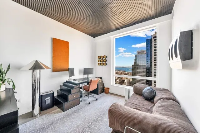a bathroom with a sink mirror vanity and toilet