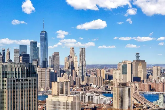 a picture of a bench in front of a wall