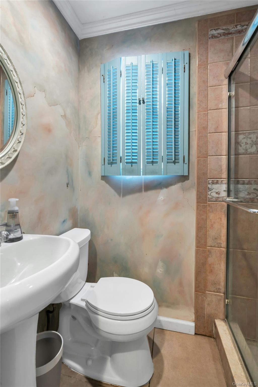 54 Valleywood Road Commack, NY 11725 - Photo 11 of 33 a bathroom with a sink a toilet and shower