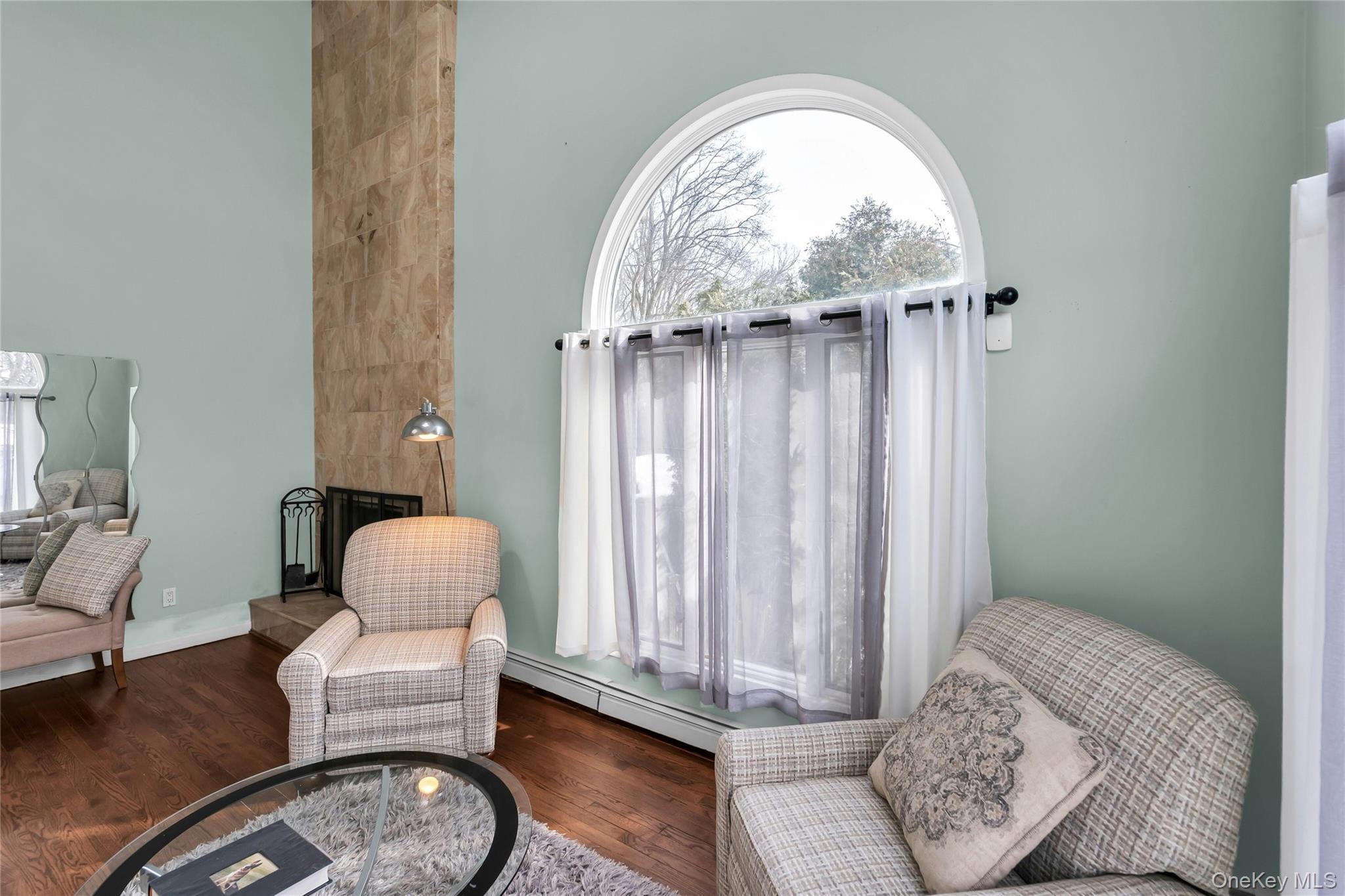 54 Valleywood Road Commack, NY 11725 - Photo 14 of 33 a living room with furniture a window and a wooden floor