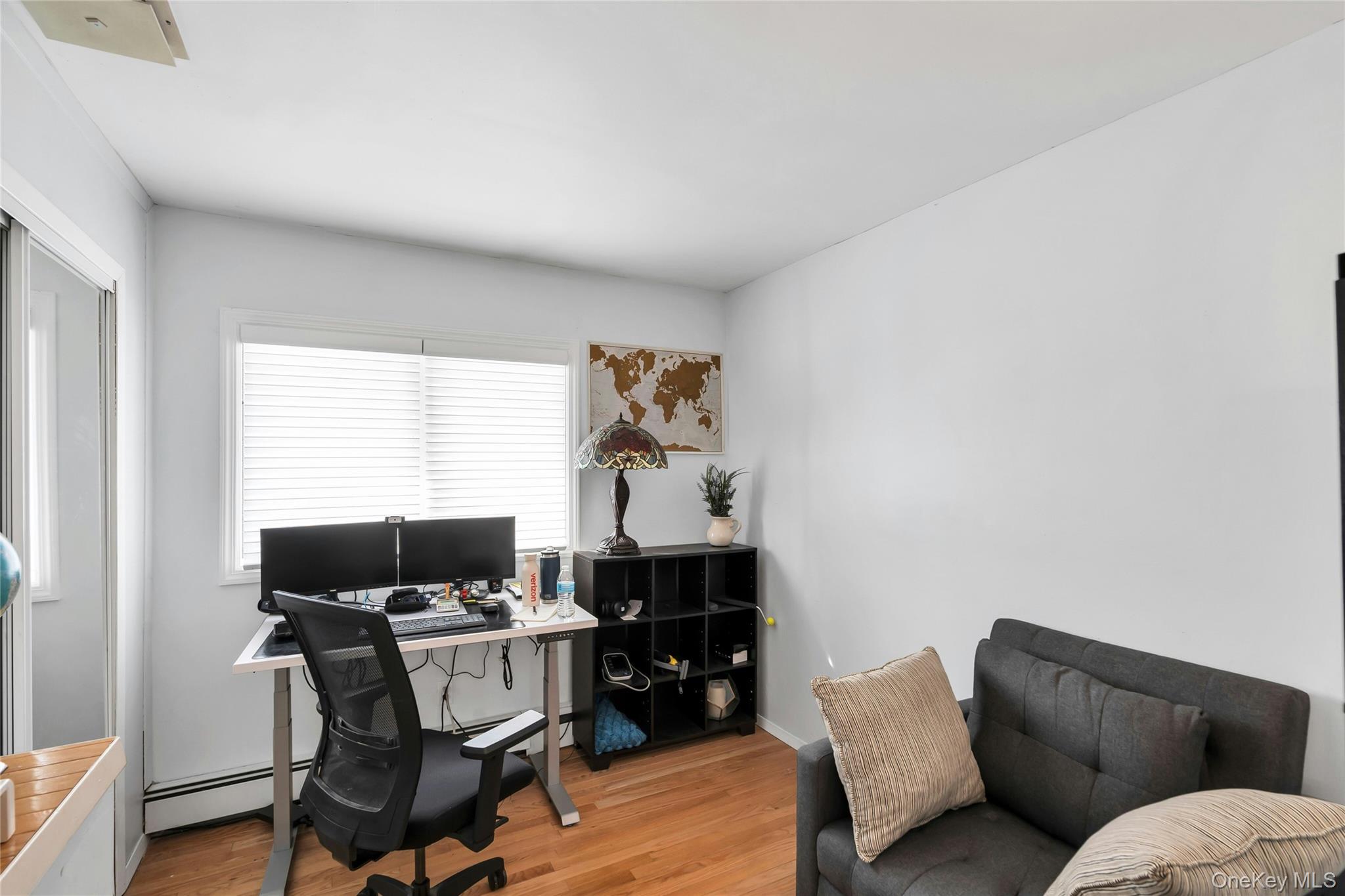 54 Valleywood Road Commack, NY 11725 - Photo 19 of 33 a living room with furniture a window and a fireplace