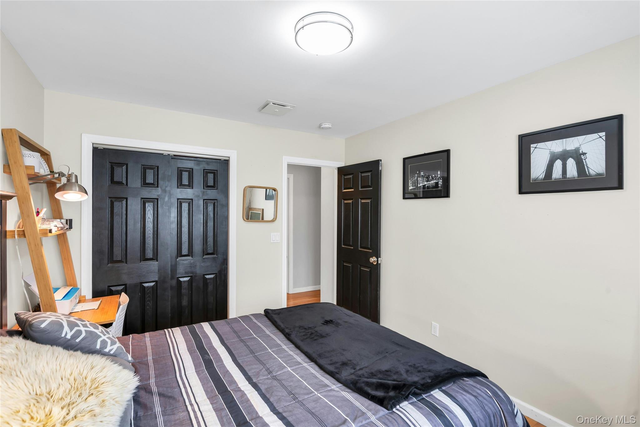 54 Valleywood Road Commack, NY 11725 - Photo 24 of 33 a bedroom with a bed and furniture