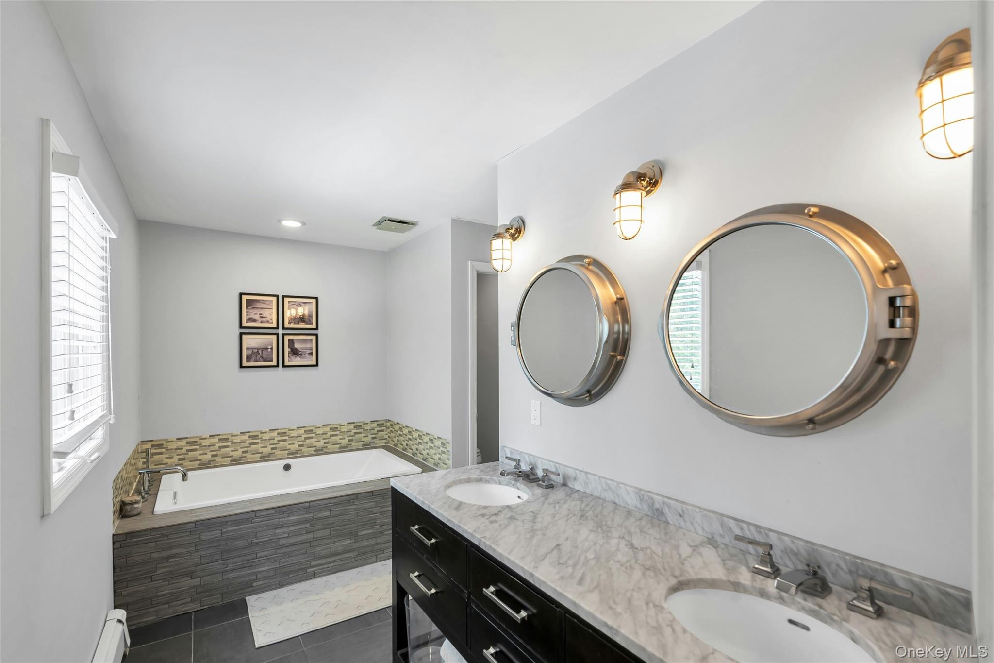 54 Valleywood Road Commack, NY 11725 - Photo 27 of 33 a bathroom with a granite countertop double vanity sink and a mirror