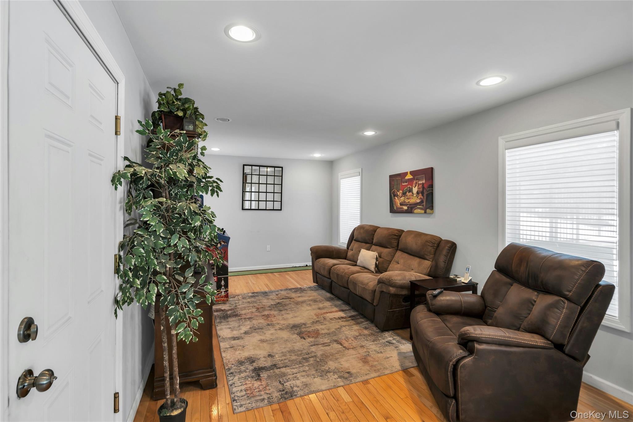 54 Valleywood Road Commack, NY 11725 - Photo 7 of 33 a living room with furniture plant and a window