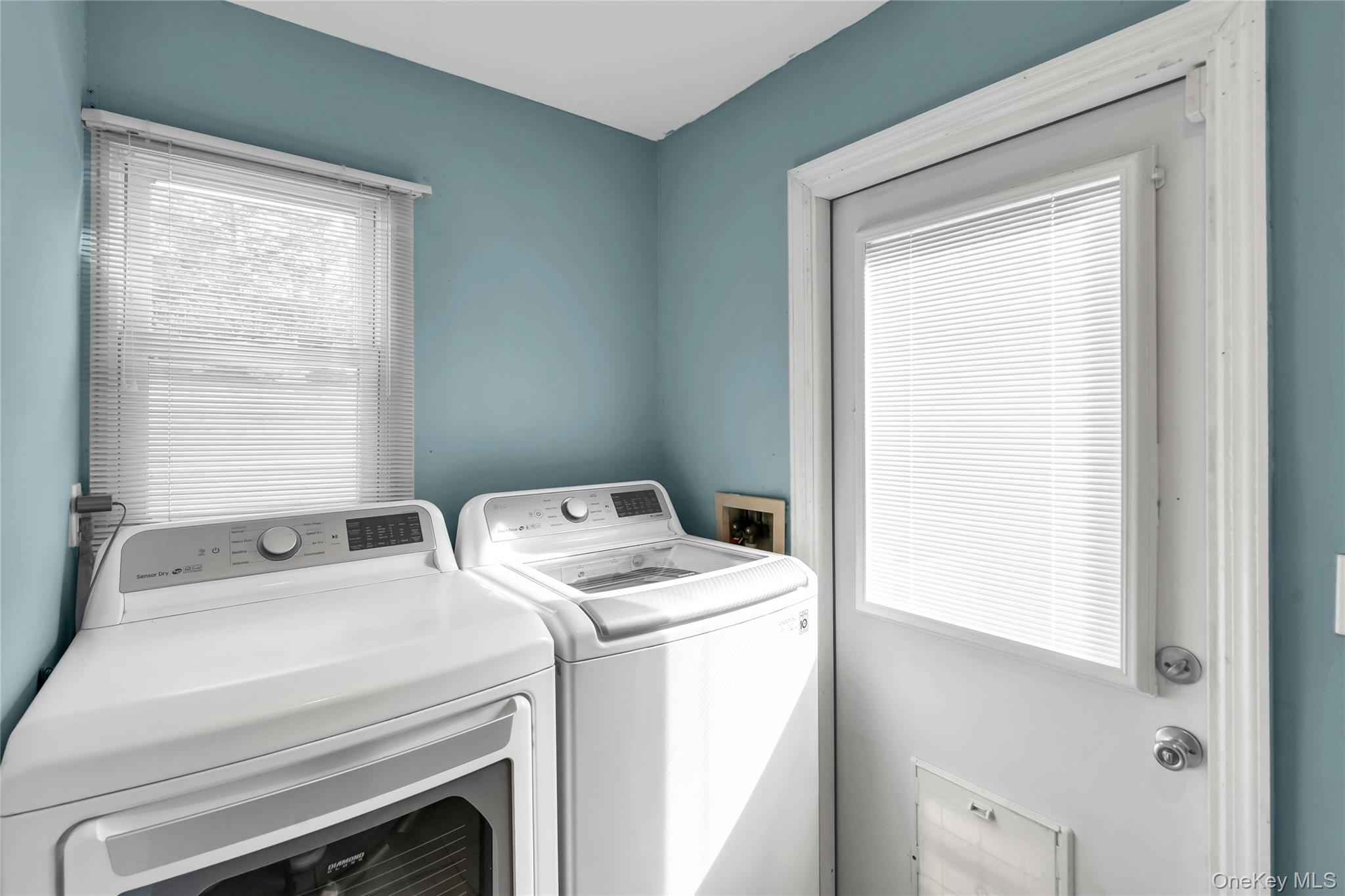 54 Valleywood Road Commack, NY 11725 - Photo 9 of 33 a utility room with dryer and washer