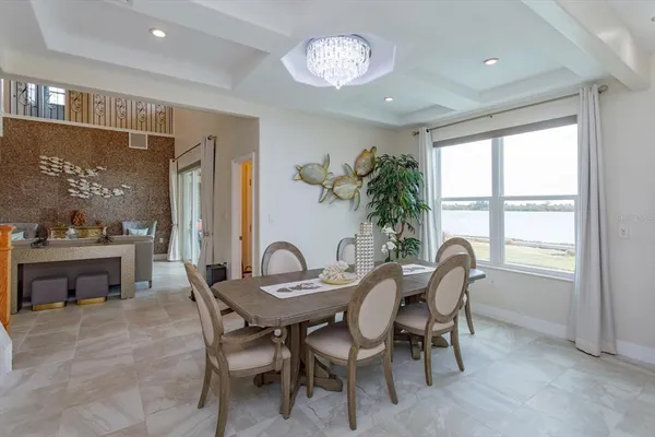 a view of a dining room with furniture window and outside view