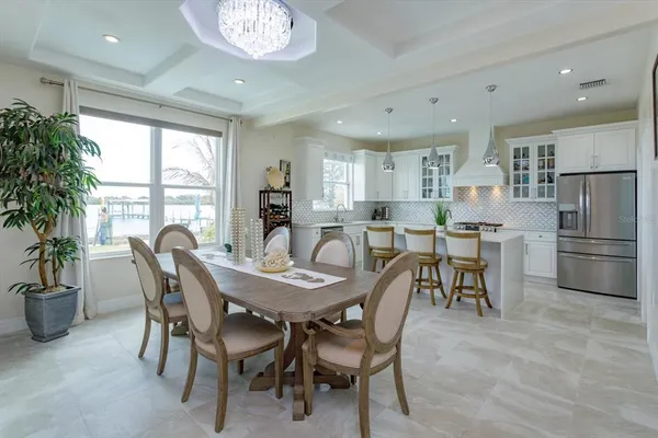 a view of a dining room with furniture and a potted plant