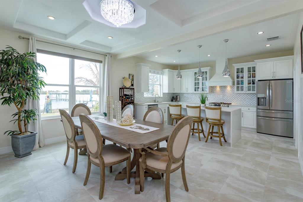 1201 South Riverside Drive Edgewater, FL 32132 - Photo 13 of 47 a view of a dining room with furniture and a potted plant